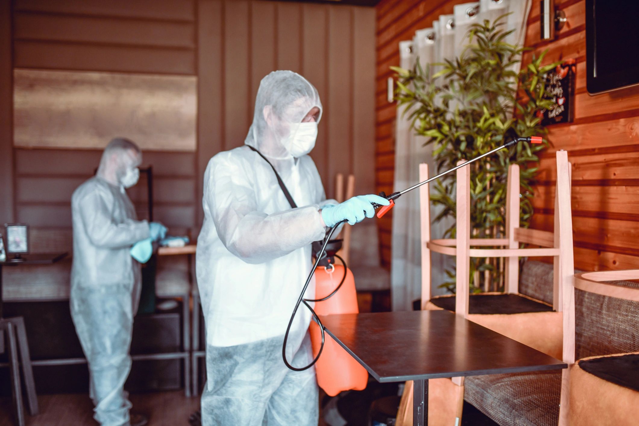 Disinfection team sanitizing a commercial space