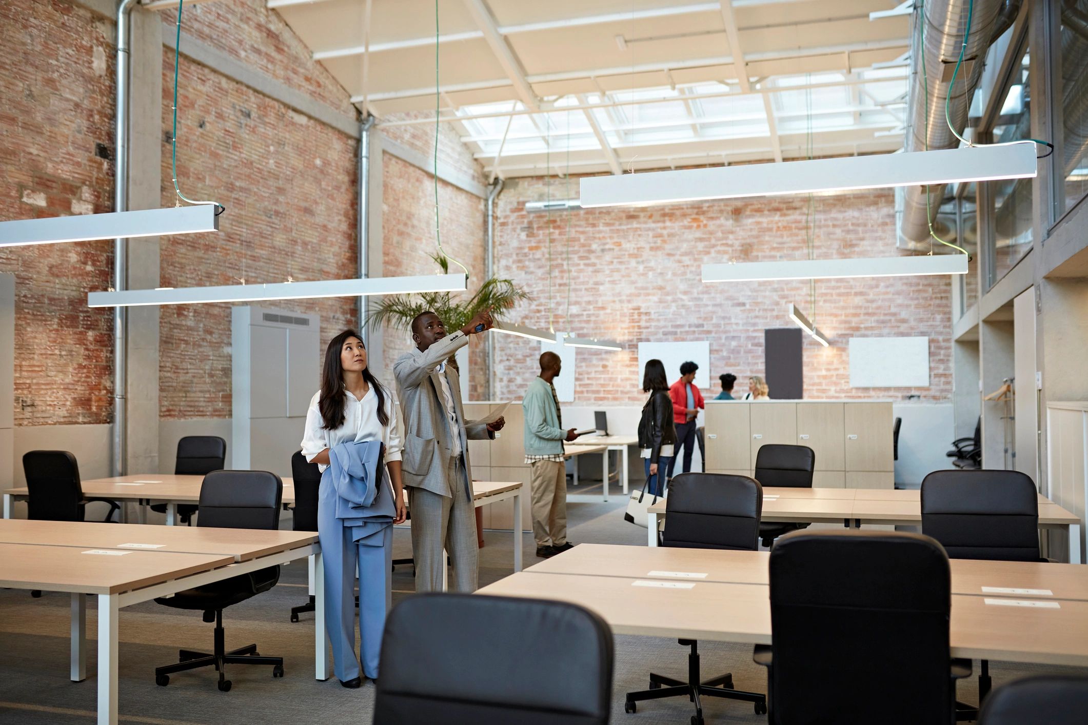 Property team touring a modern commercial office building